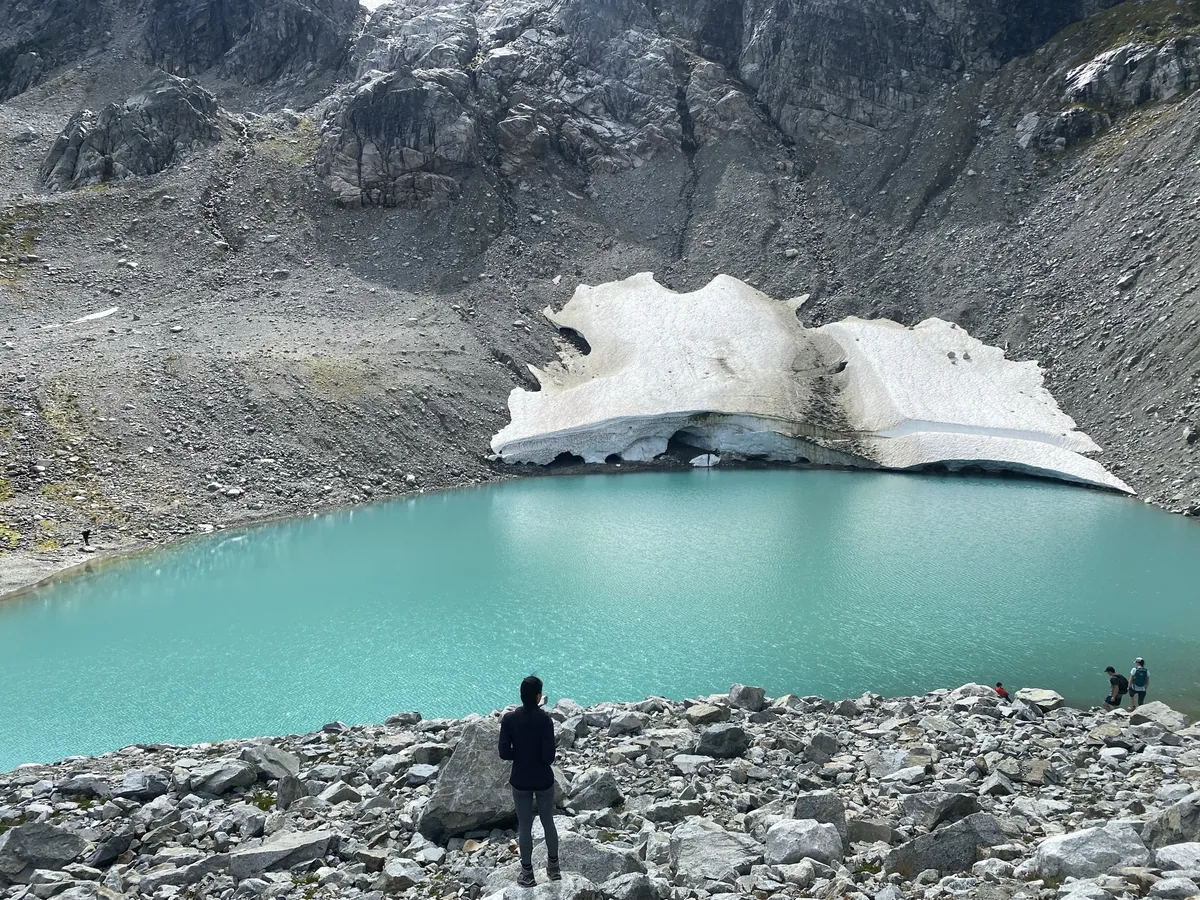 Iceberg Lake guided hike in BC — remote alpine lake with floating ice and mountain scenery